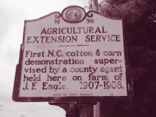 A highway marker noting the first Extension demonstration supervised by a county agent in North Carolina.